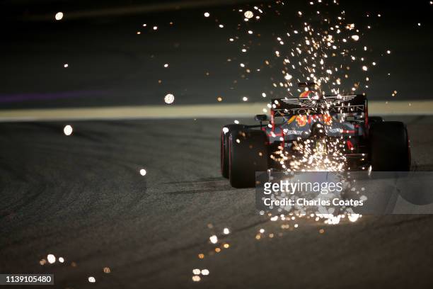 Sparks fly behind Max Verstappen of the Netherlands driving the Aston Martin Red Bull Racing RB15 on track during practice for the F1 Grand Prix of...