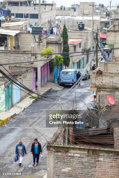 a street in a poor and populous district in the western sector of mexico city - mexico slums stock pictures, royalty-free photos & images
