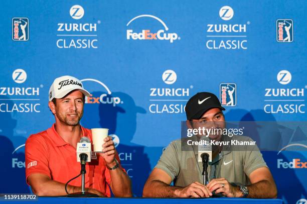 Adam Scott of Australia and Jason Day of Australia smile at a press conference during practice for the Zurich Classic of New Orleans at TPC Louisiana...