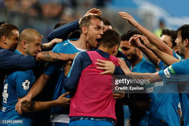 Artem Dzyuba of FC Zenit Saint Petersburg celebrates his goal with teammates during the Russian Premier League match between FC Zenit Saint...