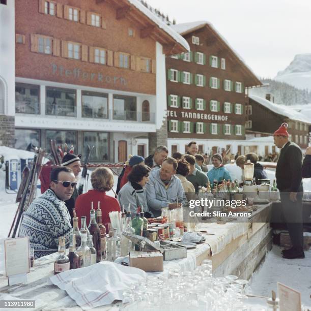 The Ice Bar at the Hotel Krone in Lech, Austria, 1960. The Hotel Pfefferkorn and Hotel Tannbergerhof are in the background.