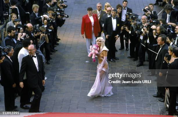 Italian actress Ilona Staller, also knwon as La Cicciolina, poses on the stairs of the Festival Palace at Cannes Film Festival in Cannes, France on...