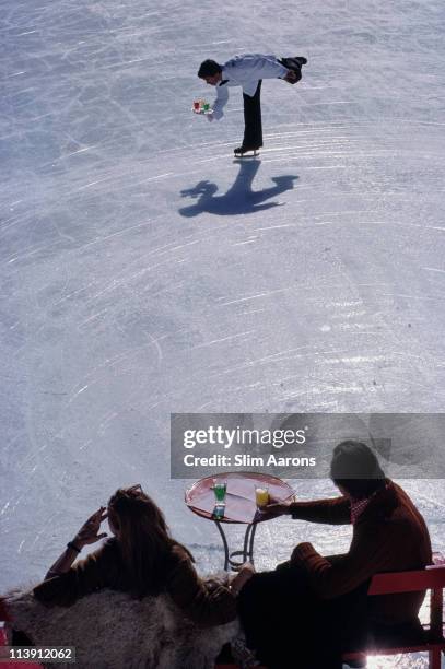 Skating cocktail waiter at the Palace Hotel in St Moritz, Switzerland, March 1978.