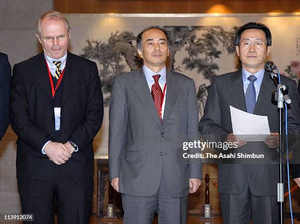 Assistant Secretary of State Christopher Hill and Japanese chief envoy Kenichiro Sasae listen as Chinese Vice Foreign Minister Wu Dawei makes a...