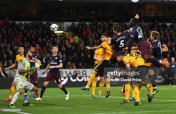 Sokratis scores Arsenal's goal during the Premier League match between Wolverhampton Wanderers and Arsenal FC at Molineux on April 24, 2019 in...