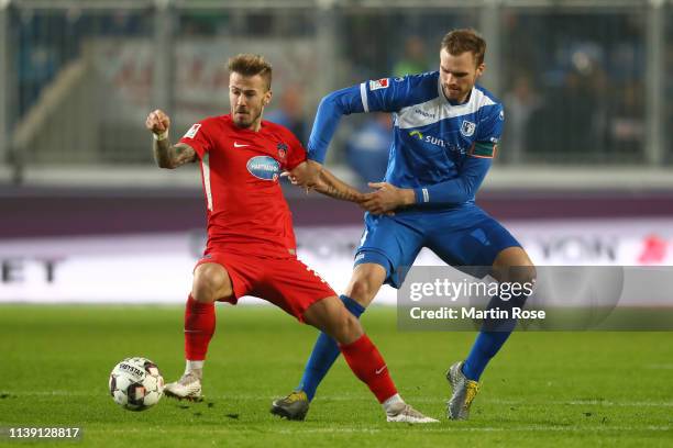 Niklas Dorsch of 1.FC Heidenheim holds off Jan Kirchhoff of 1.FC Magdeburg during the Second Bundesliga match between 1. FC Magdeburg and 1. FC...