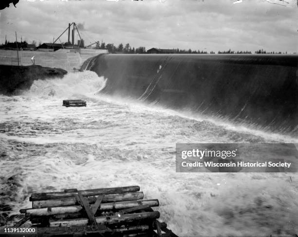 Elevated view of a dam on the river, Hatfield, Wisconsin, 1908. Identified as the Hatfield Dam.