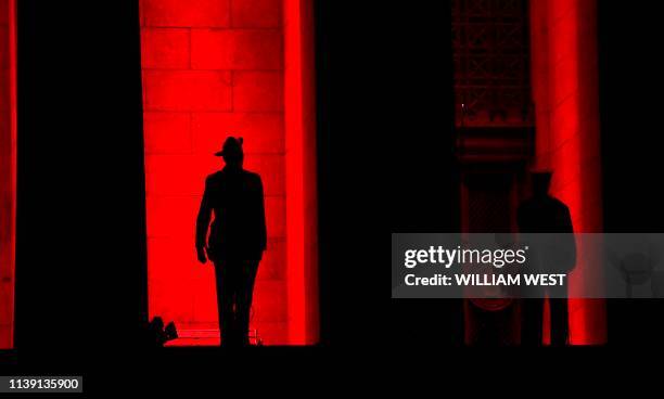 Soldier stands guard on the steps of the Shrine of Remembrance at the Anzac Day dawn service in Melbourne on April 25, 2019. - Dawn services were...