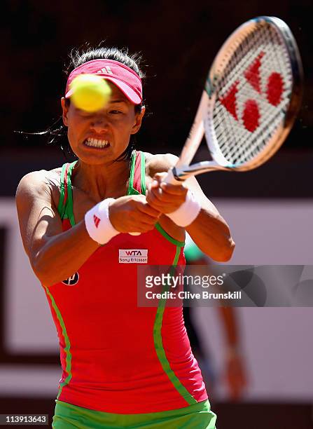 Kimiko Date-Krumm of Japan plays a backhand during first round match against Lucie Safarova of Czech Republic during day three of the Internazoinali...