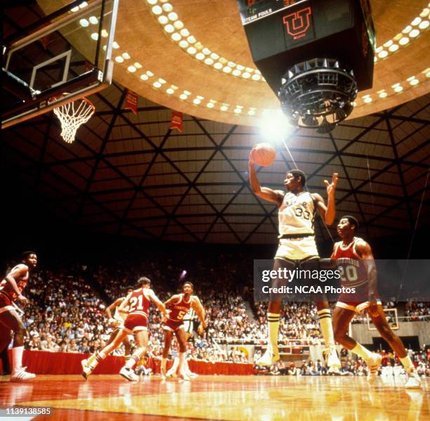 Michigan State's Earvin "Magic" Johnson grabs the rebound with University of Pennsylvania's Tim Smith close behind during the NCAA Photos via Getty...