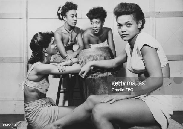 American singer and actress Eartha Kitt as a member of the Katherine Dunham Company, circa 1945. With her are other members of the dance troupe,...