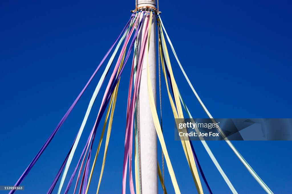 Ribbons hanging from a maypole