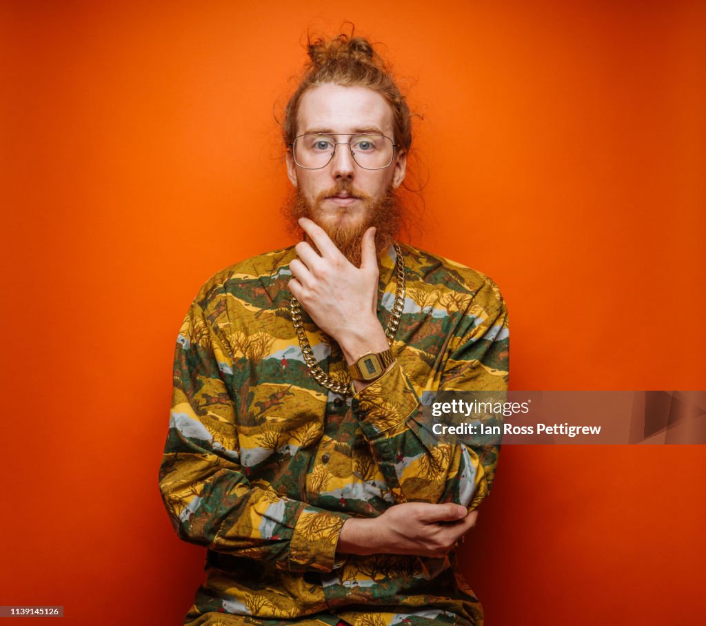 Bearded Hipster on Orange Background