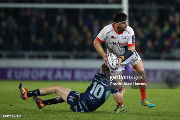 Rob Webber of Sale Sharks is tackled by Jack Carty of Connacht during the Challenge Cup Quarter Final match between Sale Sharks and Connacht Rugby at...