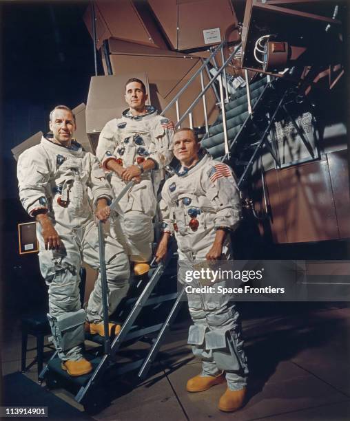 The crew of Apollo 8 in their space suits on a Kennedy Space Center simulator, Florida, USA, 13th November 1968. Left to right: James A. Lovell Jr.,...