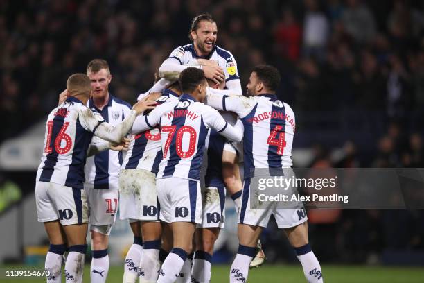 Jake Livermore of West Brom is mobbed by team mates after scoring to make it 3-2 during the Sky Bet Championship match between West Bromwich Albion...