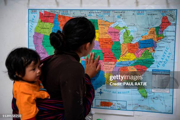 Guatemalan woman looks at a map of the United States at the Casa del Refugiado, or The House of Refugee, a new centre opened by the Annunciation...