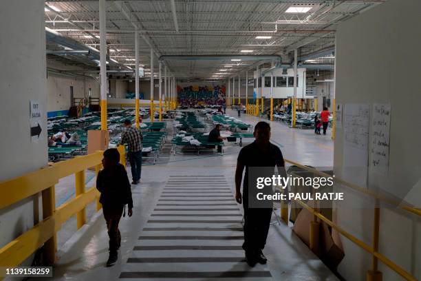 Migrants from different Latin American countries walk inside the Casa del Refugiado, or The House of Refugee, a new centre opened by the Annunciation...