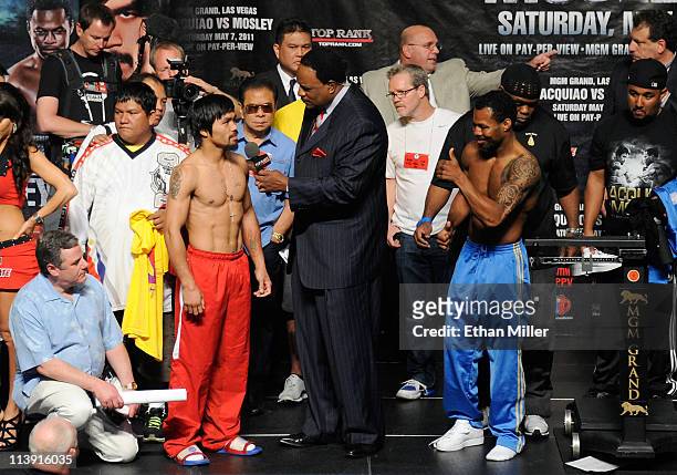 Sportscaster James Brown interviews boxers Manny Pacquiao and Shane Mosley during the official weigh-in for their bout at the MGM Grand Garden Arena...