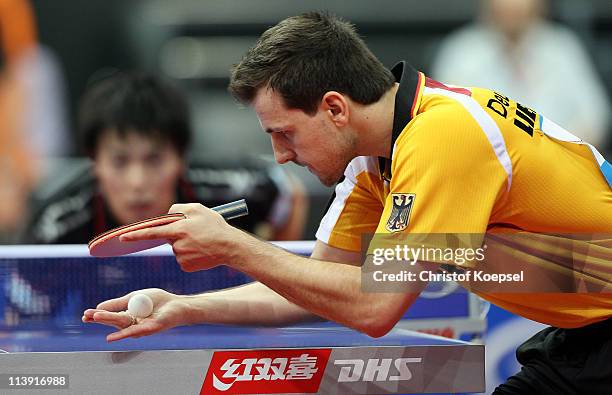 Timo Boll of Germany serves during the first round Men's Single match against Kenji Matsudaira of Japan during the World Table Tennis Championships...