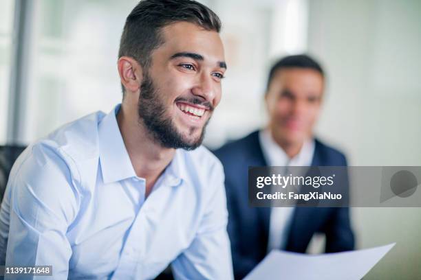 business colleague smiling in office meeting - happy candidate stock pictures, royalty-free photos & images