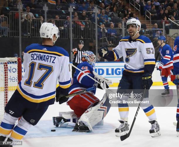 David Perron of the St. Louis Blues celebrates his goal at 15:02 of the first period against Alexandar Georgiev of the New York Rangers and is joined...