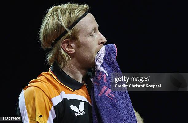 Christian Suess of Germany looks dejected during the first round Men's Single match against Jan Song Man of North-Korea during the World Table Tennis...