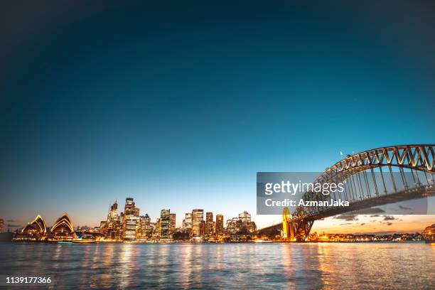 landscape view of the sydney harbor bridge in the evening - sydney stock pictures, royalty-free photos & images
