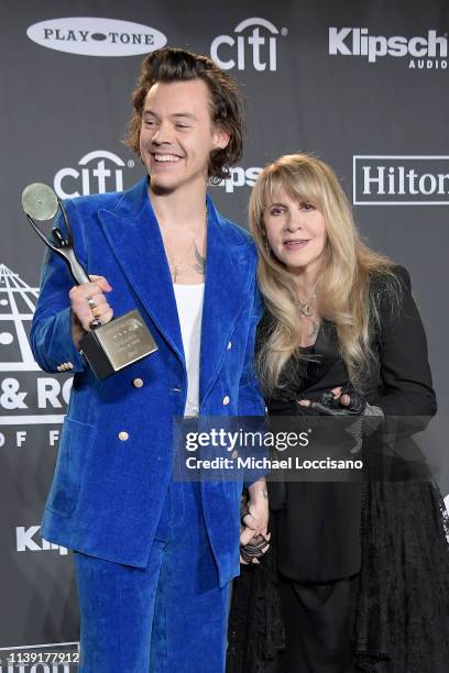 Harry Styles and inductee Stevie Nicks pose in the press room during the 2019 Rock & Roll Hall Of Fame Induction Ceremony - Press Room at Barclays...