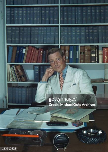 The Duke of Windsor sitting at a desk, which is strewn with books and paperwork in Goverment House in Nassau, the Bahamas, circa 1942. The Duke of...