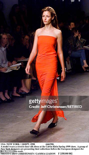 Model wears a stretch sheer silk dress at the Calvin Klein Spring 1999 show in New York September 18. A group of New York designers are presenting...