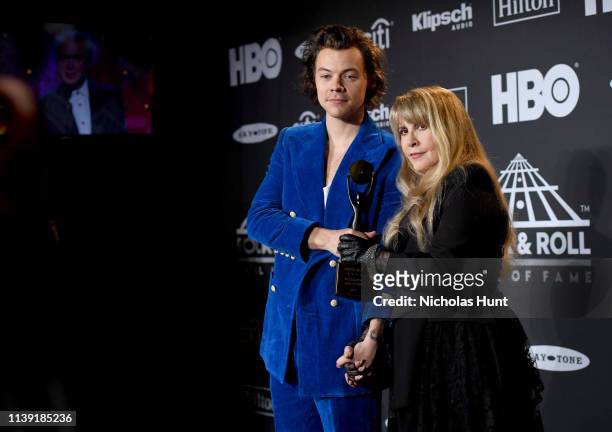 Harry Styles and inductee Stevie Nicks pose in the press room during the 2019 Rock & Roll Hall Of Fame Induction Ceremony - Press Room at Barclays...