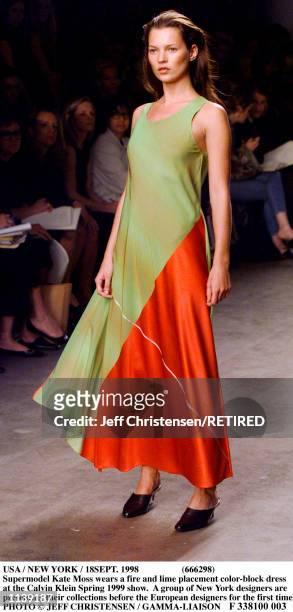 Supermodel Kate Moss wears a fire and lime placement color-block dress at the Calvin Klein Spring 1999 show in New York September 18. A group of New...