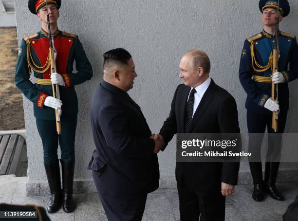 Russian President Vladimir Putin greets North Korean Leader Kim Jong-un before a meeting April 25, 2019 in Vladivostok, Russia. Kim Jong-un is on his...