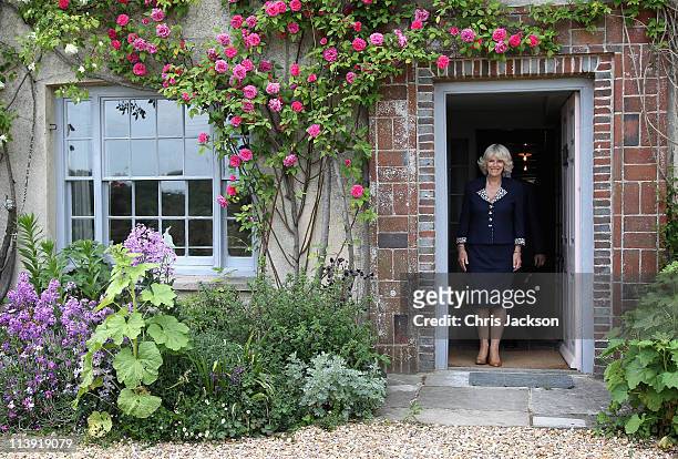 Camilla, Duchess of Cornwall poses in the doorway of Charleston House during a tour on May 10, 2011 in Selmeston, United Kingdom. Charleston House is...