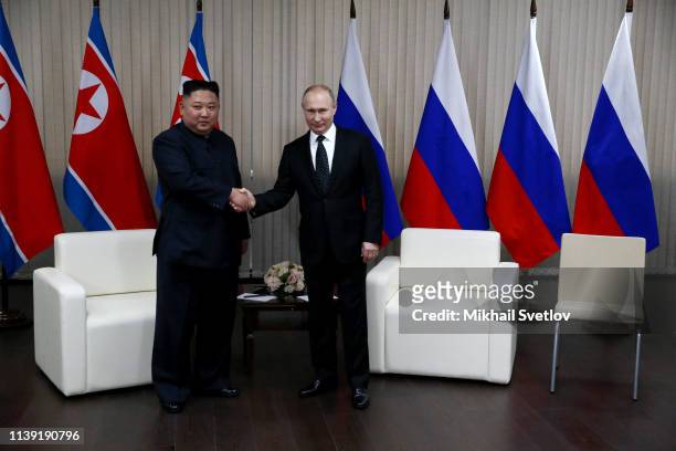 Russian President Vladimir Putin greets North Korean Leader Kim Jong-un during their meeting on April 25, 2019 in Vladivostok, Russia. Russian...