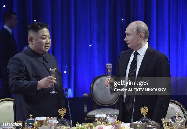 Russian President Vladimir Putin and North Korean leader Kim Jong Un attend a reception following their talks at the Far Eastern Federal University...