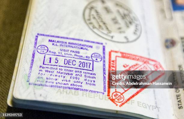 immigration stamps at malaysia kuala lumpur airport - egypt passport stamp stock pictures, royalty-free photos & images