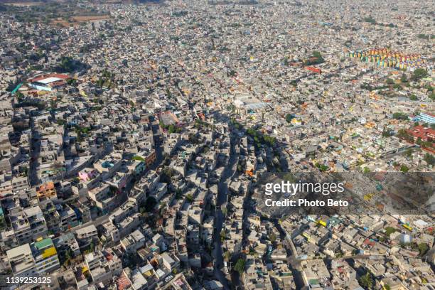 an impressive aerial view of a densely populated district in southern mexico city - mexico slums stock pictures, royalty-free photos & images