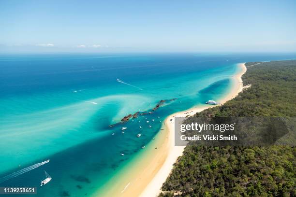 aerial views over ocean waters at morton bay island - brisbane beach stock pictures, royalty-free photos & images