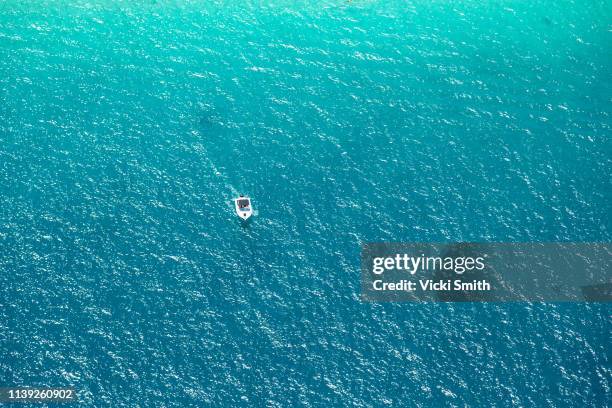 aerial views over ocean waters at morton bay island - helicopter point of view stock pictures, royalty-free photos & images