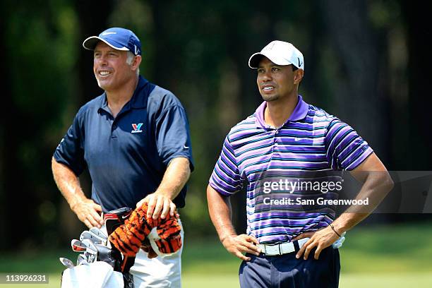 Tiger Woods and caddie Steve Williams look on during a practice round prior to the start of THE PLAYERS Championship held at THE PLAYERS Stadium...