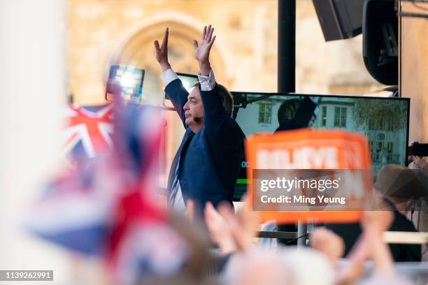 Nigel Farage celebrates on stage during a pro-Brexit rally at Parliament Square on March 29, 2019 in London, England. Today pro-Brexit supporters...