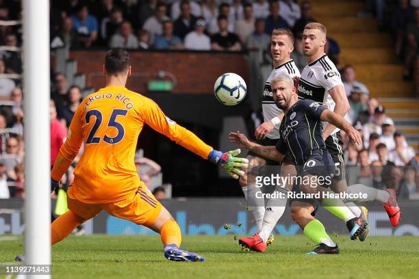 Sergio Aguero of Manchester City scores his team's second goal past Sergio Rico of Fulham during the Premier League match between Fulham FC and...