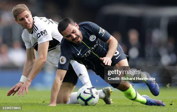 Ilkay Gundogan of Manchester City is challenged by Maxime Le Marchand of Fulham during the Premier League match between Fulham FC and Manchester City...