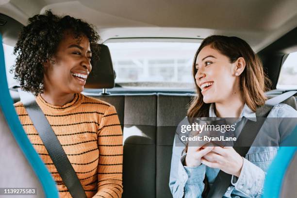 women in car rideshare in city of los angeles - riding car stock pictures, royalty-free photos & images