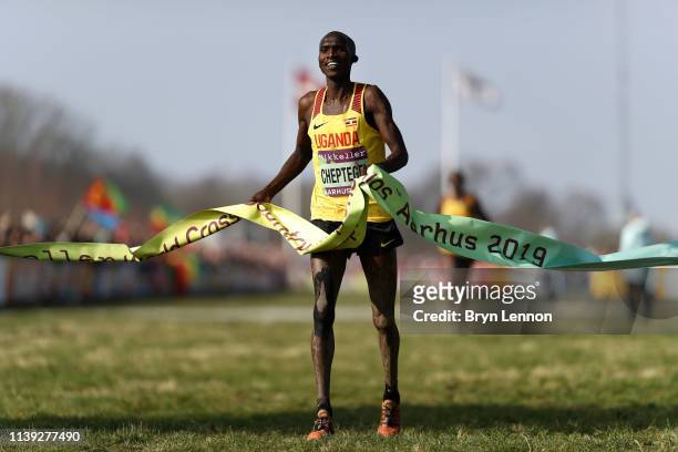 Joshua Cheptegei of Uganda crosses the line to win the Men's Senior Final during the IAAF World Athletics Cross Country Championships on March 30,...