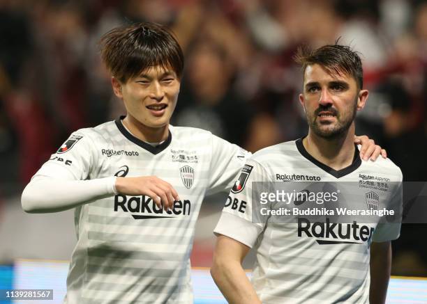 David Villa of Vissel Kobe celebrates with his team mate Sergi Samper after soccer his side second goal during the J.League J1 match between Gamba...
