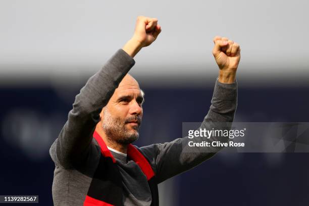 Josep Guardiola, Manager of Manchester City celebrates whilst wearing a black and red scarf in memory of former club secretary Bernard Halford...