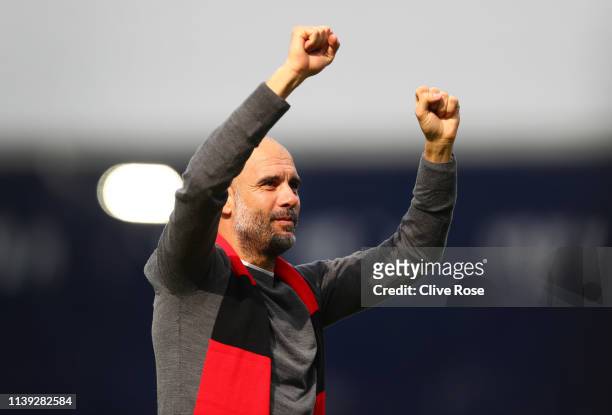 Josep Guardiola, Manager of Manchester City celebrates whilst wearing a black and red scarf in memory of former club secretary Bernard Halford...